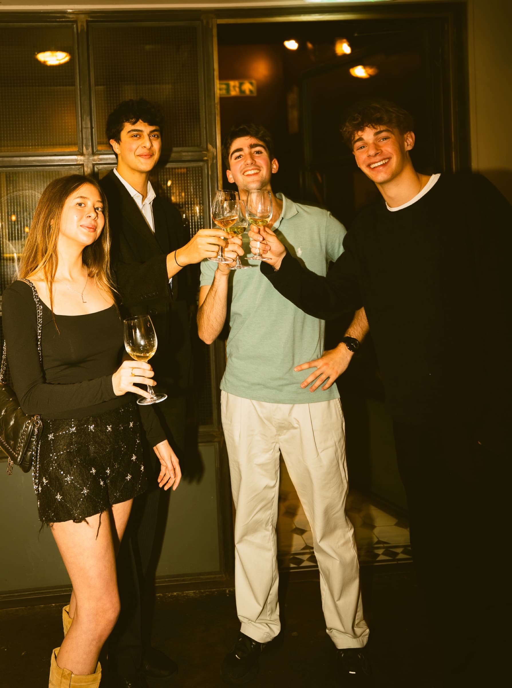 Guests enjoying a glass of wine at a Clarity event